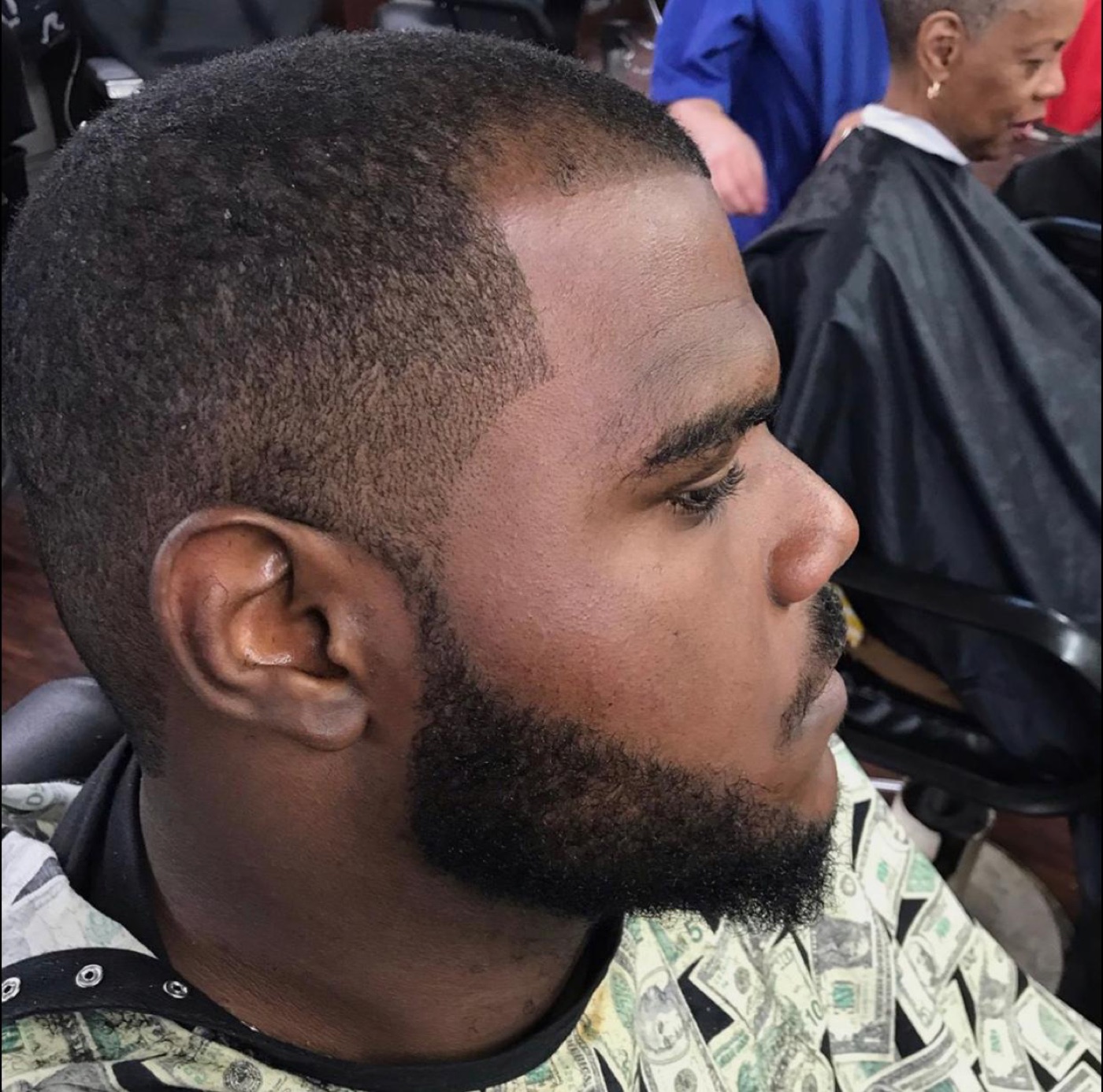 ABI student giving a client a fresh haircut